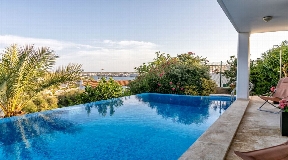 Wonderful villa with pool at Cala Llonga in Menorca with views over the port of Mahon