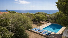 Modern villa with spectacular views over the beach of Santo Tomas in Menorca