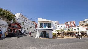 Residential and commercial building in the front of the sea in Cala Fonts Menorca